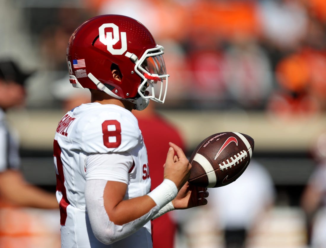 Oklahoma's Dillon Gabriel (8) warms up before a Bedlam college football game between the Oklahoma State University Cowboys (OSU) and the University of Oklahoma Sooners (OU) at Boone Pickens Stadium in Stillwater, Okla., Saturday, Nov. 4, 2023.
