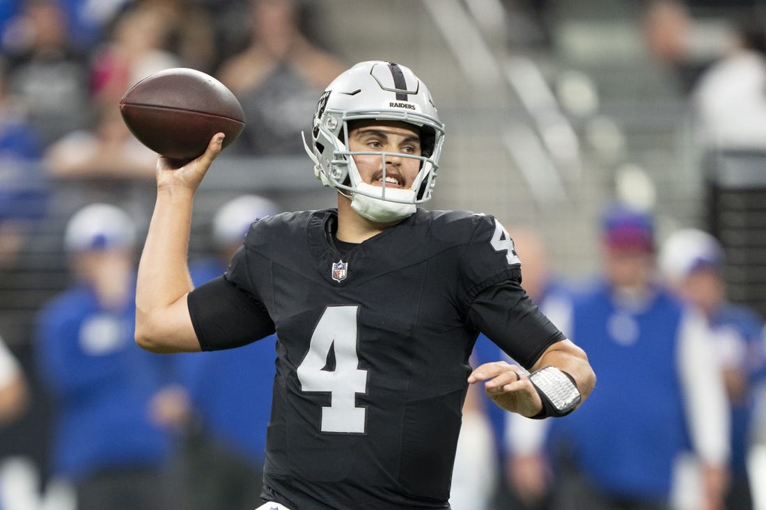 November 5, 2023; Paradise, Nevada, USA; Las Vegas Raiders quarterback Aidan O'Connell (4) passes the football against the New York Giants during the first quarter at Allegiant Stadium. Mandatory Credit: Kyle Terada-USA TODAY Sports