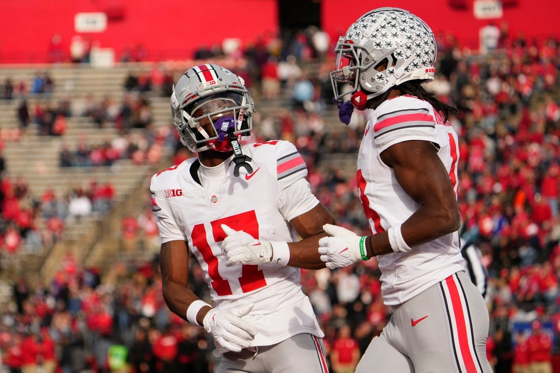 Nov 4, 2023; Piscataway, New Jersey, USA; Ohio State Buckeyes wide receiver Carnell Tate (17) congratulates wide receiver Marvin Harrison Jr. (18) after he scored a touchdown during the NCAA football game against the Rutgers Scarlet Knights at SHI Stadium. Ohio State won 35-16.