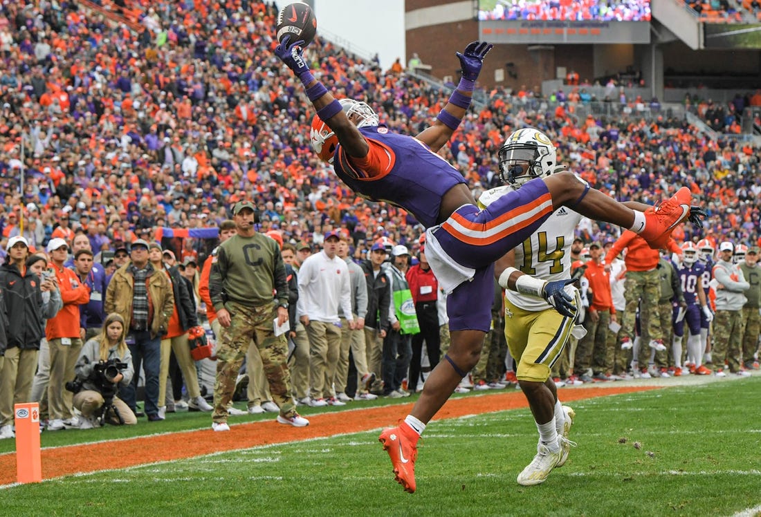 Nov 11, 2023; Clemson, South Carolina, USA; Clemson Tigers receiver Tyler Brown (6) catches a pass for a touchdown against Georgia Tech Yellow Jackets defensive back Jayloh King (14) during the second quarter  at Memorial Stadium. Mandatory Credit: Ken Ruinard-USA TODAY Sports