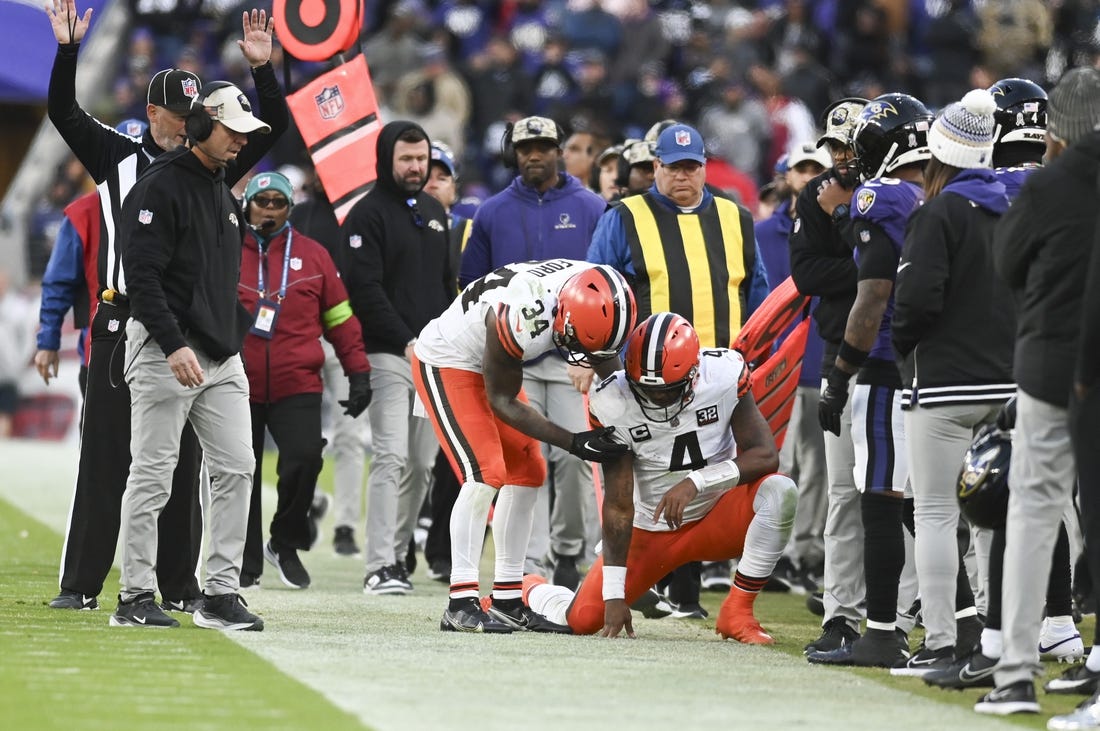 Nov 12, 2023; Baltimore, Maryland, USA;  Cleveland Browns quarterback Deshaun Watson (4) is helped up by  running back Jerome Ford (34) after being tackled out of bounds during the second half against the Baltimore Ravens at M&T Bank Stadium. Mandatory Credit: Tommy Gilligan-USA TODAY Sports