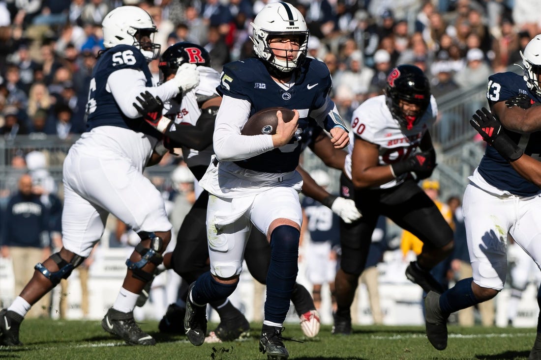 Penn State quarterback Drew Allar keeps the ball on the ground during an NCAA football game against Rutgers Saturday, Nov. 18, 2023, in State College, Pa. The Nittany Lions won, 27-6.