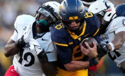West Virginia Mountaineers quarterback Garrett Greene (6) carries the ball on a touchdown run in the third quarter during an NCAA college football game between the Cincinnati Bearcats and the West Virginia Mountaineers, Saturday, Nov. 18, 2023, at Milan Puskar Stadium in Morgantown, W. Va. The West Virginia Mountaineers won, 42-21.