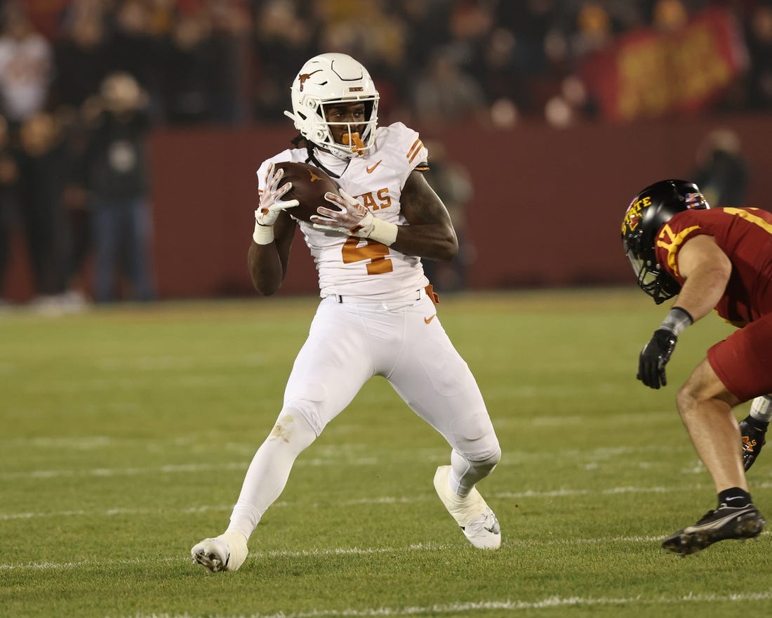 Nov 18, 2023; Ames, Iowa, USA; Texas Longhorns running back CJ Baxter (4) catches a pass against the Iowa State Cyclones at Jack Trice Stadium. Mandatory Credit: Reese Strickland-USA TODAY Sports