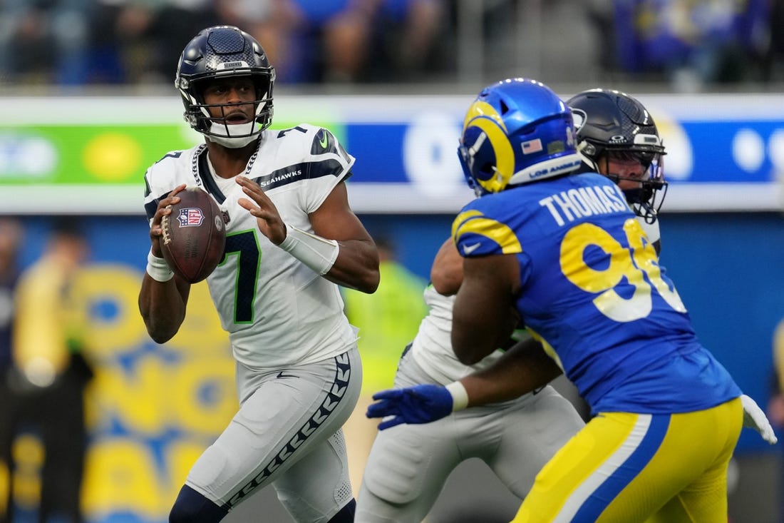 Nov 19, 2023; Inglewood, California, USA; Seattle Seahawks quarterback Geno Smith (7) looks to pass against the Los Angeles Rams in the second quarter at SoFi Stadium. Mandatory Credit: Kirby Lee-USA TODAY Sports