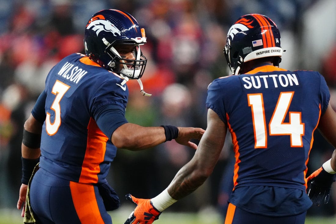 Nov 19, 2023; Denver, Colorado, USA; Denver Broncos quarterback Russell Wilson (3) and wide receiver Courtland Sutton (14) before the game at Empower Field at Mile High. Mandatory Credit: Ron Chenoy-USA TODAY Sports