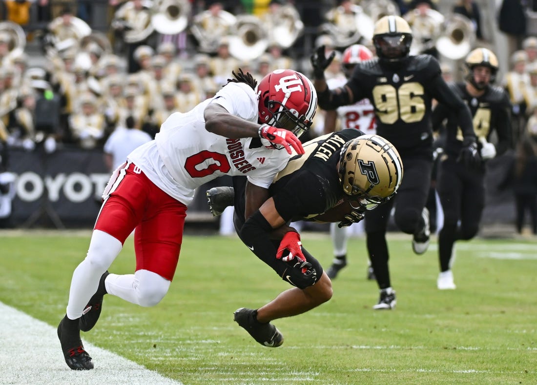 Nov 25, 2023; West Lafayette, Indiana, USA; Purdue Boilermakers defensive back Cam Allen (10) intercepts a pass intended for Indiana Hoosiers wide receiver Andison Coby (0) during the first half at Ross-Ade Stadium. Mandatory Credit: Robert Goddin-USA TODAY Sports