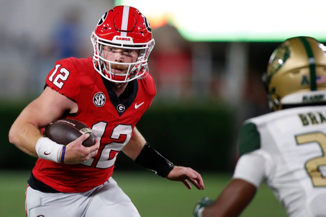 Georgia quarterback Brock Vandagriff (12) runs the ball during the second half of a NCAA college football game against UAB in Athens, Ga., on Saturday, Sept. 23, 2023.