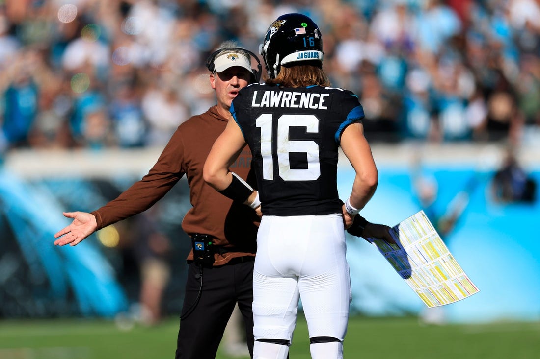 Jacksonville Jaguars head coach Doug Pederson talks with quarterback Trevor Lawrence (16) during the second quarter an NFL football matchup Sunday, Nov. 19, 2023 at EverBank Stadium in Jacksonville, Fla. The Jacksonville Jaguars defeated the Tennessee Titans 34-14. [Corey Perrine/Florida Times-Union]