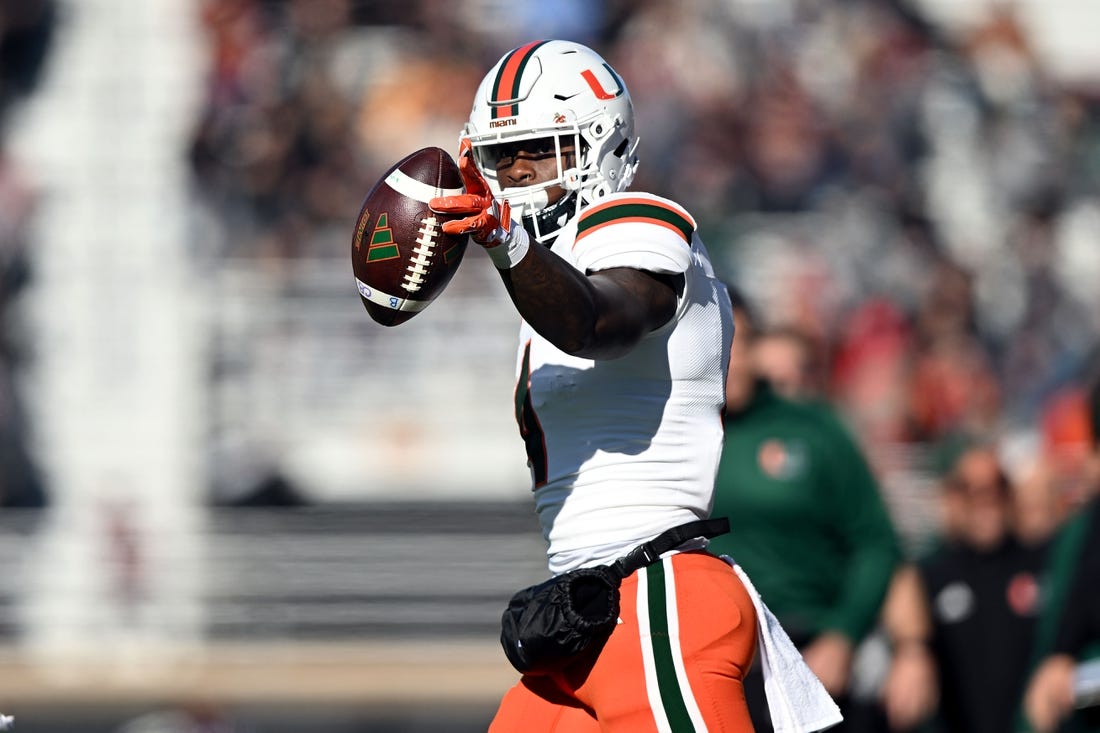 Nov 24, 2023; Chestnut Hill, Massachusetts, USA; Miami Hurricanes wide receiver Colbie Young (4) reacts after making a reception against the Boston College Eagles during the first half at Alumni Stadium. Mandatory Credit: Brian Fluharty-USA TODAY Sports
