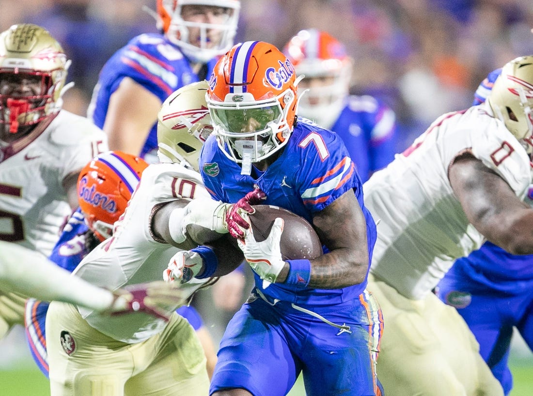 Florida Gators running back Trevor Etienne (7) makes yards during first half action as Florida takes on Florida State at Steve Spurrier Field at Ben Hill Griffin Stadium in Gainesville, FL on Saturday, November 25, 2023. [Alan Youngblood/Gainesville Sun]