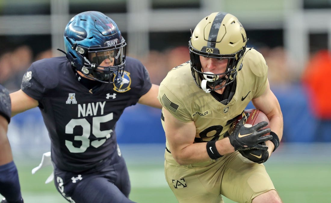 Dec 9, 2023; Foxborough, Massachusetts, USA; Army Black Knights wide receiver Casey Reynolds (87) is chased by Navy Midshipmen safety Kush'i Abraham (35) during the first half of the Army-Navy Game at Gillette Stadium. Mandatory Credit: Danny Wild-USA TODAY Sports