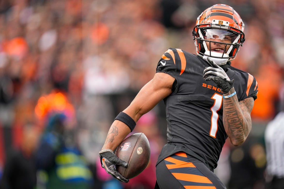 Cincinnati Bengals wide receiver Ja'Marr Chase (1) smiles after completing a deep pass in the first quarter of the NFL Week 15 game between the Cincinnati Bengals and the Minnesota Vikings at PayCor Stadium in downtown Cincinnati on Saturday, Dec. 16, 2023.