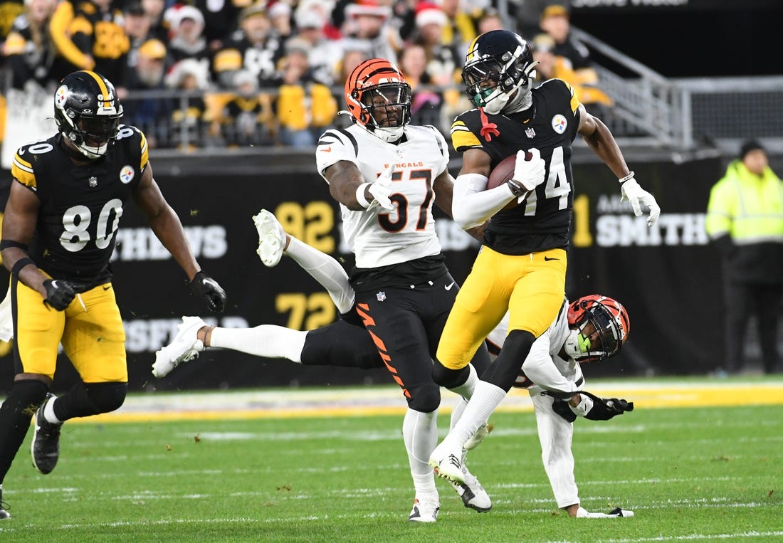 Dec 23, 2023; Pittsburgh, Pennsylvania, USA;  Pittsburgh Steelers wide receiver George Pickens outpaces the Cincinnati Bengals defense for an 86 yard touchdown in the first quarter at Acrisure Stadium. Mandatory Credit: Philip G. Pavely-USA TODAY Sports