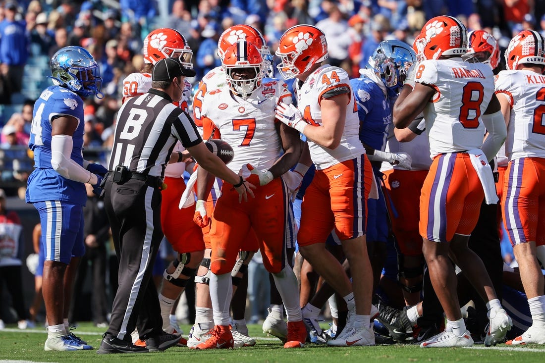 Dec 29, 2023; Jacksonville, FL, USA;  Clemson Tigers running back Phil Mafah (7) runs the ball into the end zone for a touchdown against the Kentucky Wildcats in the second quarter during the Gator Bowl at EverBank Stadium. Mandatory Credit: Nathan Ray Seebeck-USA TODAY Sports
