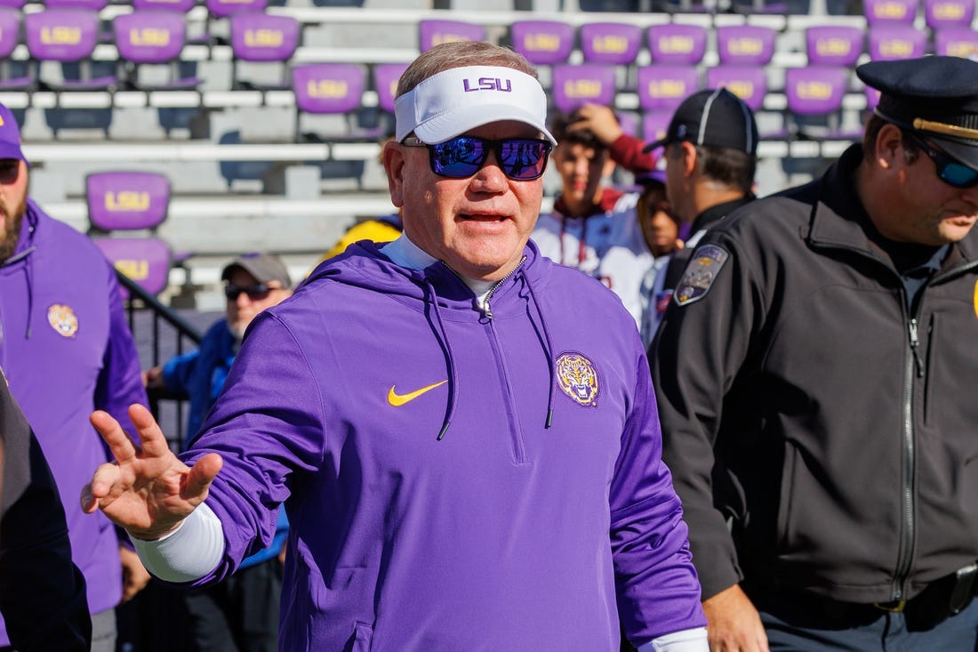 Nov 25, 2023; Baton Rouge, Louisiana, USA;  LSU Tigers head coach Brian Kelly waves to fans during warmups before the game against the Texas A&M Aggies at Tiger Stadium. Mandatory Credit: Stephen Lew-USA TODAY Sports