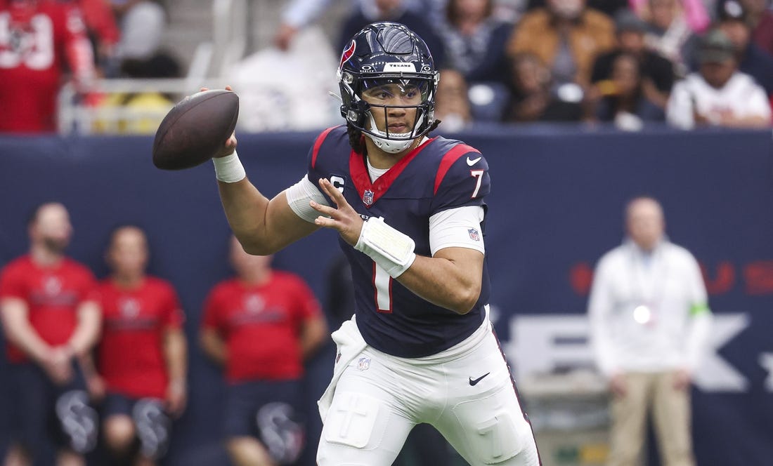 Dec 31, 2023; Houston, Texas, USA; Houston Texans quarterback C.J. Stroud (7) attempts a pass during the third quarter against the Tennessee Titans at NRG Stadium. Mandatory Credit: Troy Taormina-USA TODAY Sports