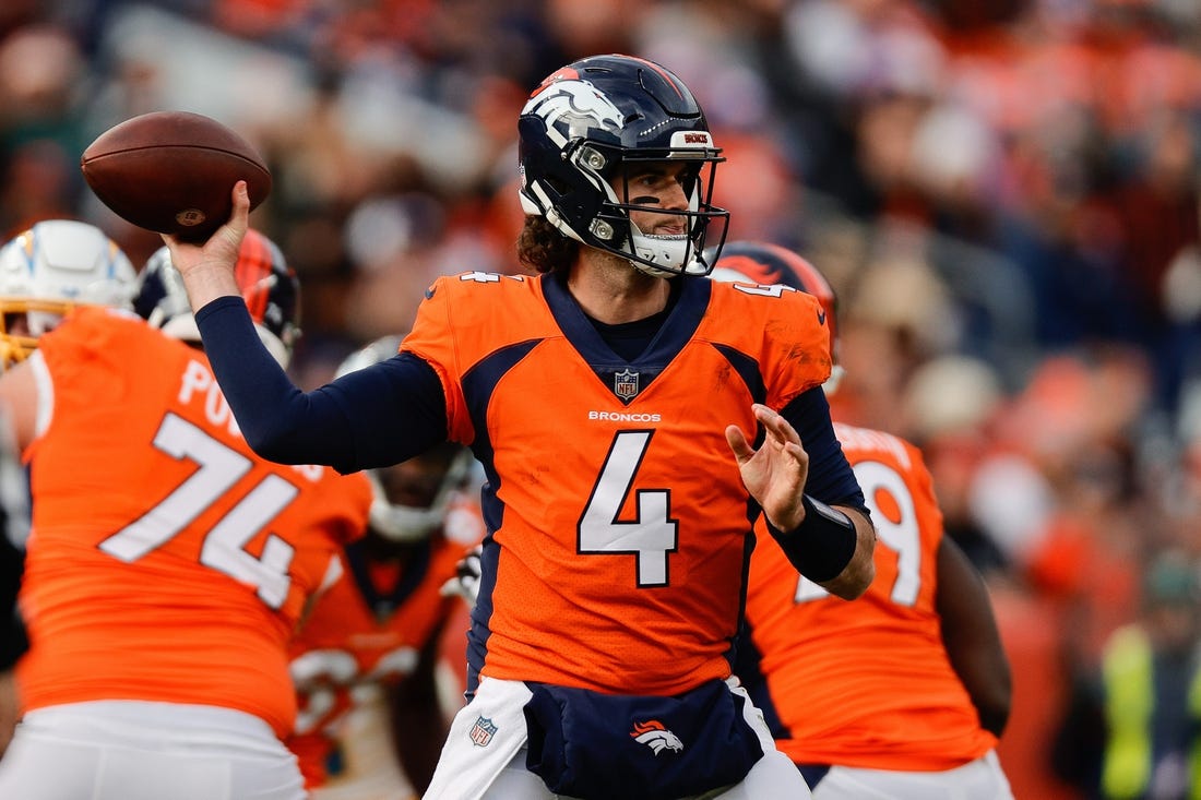 Dec 31, 2023; Denver, Colorado, USA; Denver Broncos quarterback Jarrett Stidham (4) attempts a pass in the first quarter against the Los Angeles Chargers at Empower Field at Mile High. Mandatory Credit: Isaiah J. Downing-USA TODAY Sports
