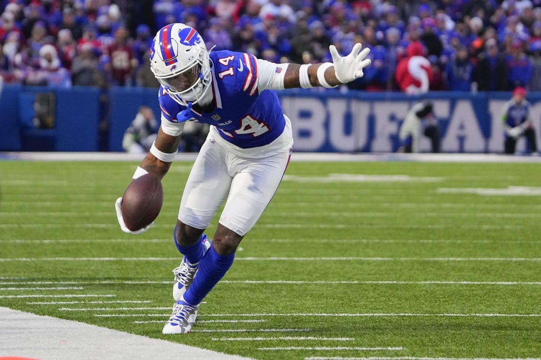 Dec 31, 2023; Orchard Park, New York, USA; Buffalo Bills wide receiver Stefon Diggs (14) runs with the ball along the sidelines after making a catch against the New England Patriots during the second half at Highmark Stadium. Mandatory Credit: Gregory Fisher-USA TODAY Sports