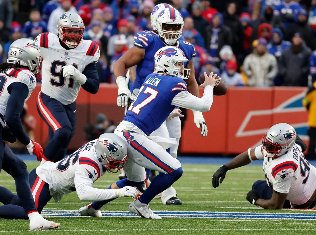 Buffalo Bills quarterback Josh Allen (17) is tackled after scrambling out of the pocket.