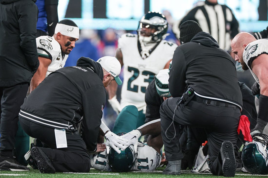 Jan 7, 2024; East Rutherford, New Jersey, USA; Philadelphia Eagles wide receiver A.J. Brown (11) reacts after an injury against the New York Giants during the first quarter at MetLife Stadium. Mandatory Credit: Vincent Carchietta-USA TODAY Sports