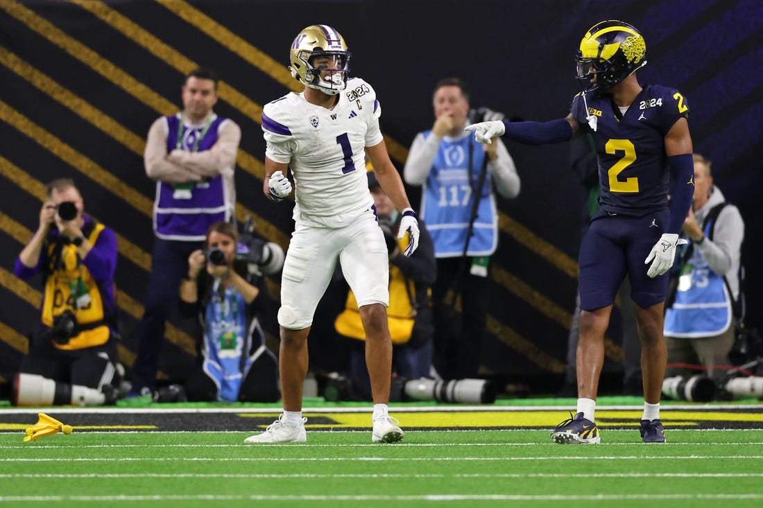 Jan 8, 2024; Houston, TX, USA; Washington Huskies wide receiver Rome Odunze (1) and Michigan Wolverines defensive back Will Johnson (2) react after a flag was thrown during the fourth quarter in the 2024 College Football Playoff national championship game at NRG Stadium. Mandatory Credit: Thomas Shea-USA TODAY Sports