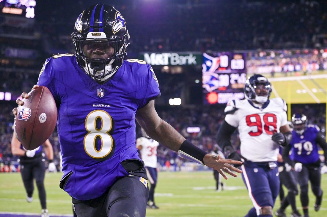 Jan 20, 2024; Baltimore, MD, USA; Baltimore Ravens quarterback Lamar Jackson (8) reacts after running past for Houston Texans defensive tackle Sheldon Rankins (98) for a touchdown during the fourth quarter  in a 2024 AFC divisional round game at M&T Bank Stadium. Mandatory Credit: Tommy Gilligan-USA TODAY Sports