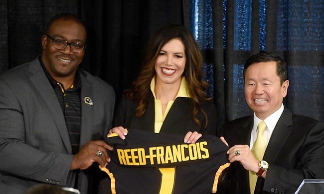 University of Missouri Curator Daryl Chatman, left, and System President Mun Choi present new athletic director Desiree Reed-Francois with a jersey Wednesday after she was formally introduced at the Walsworth Family Columns Club.

20210811 033a Mu Athletic Director Reed Francois Press Conf