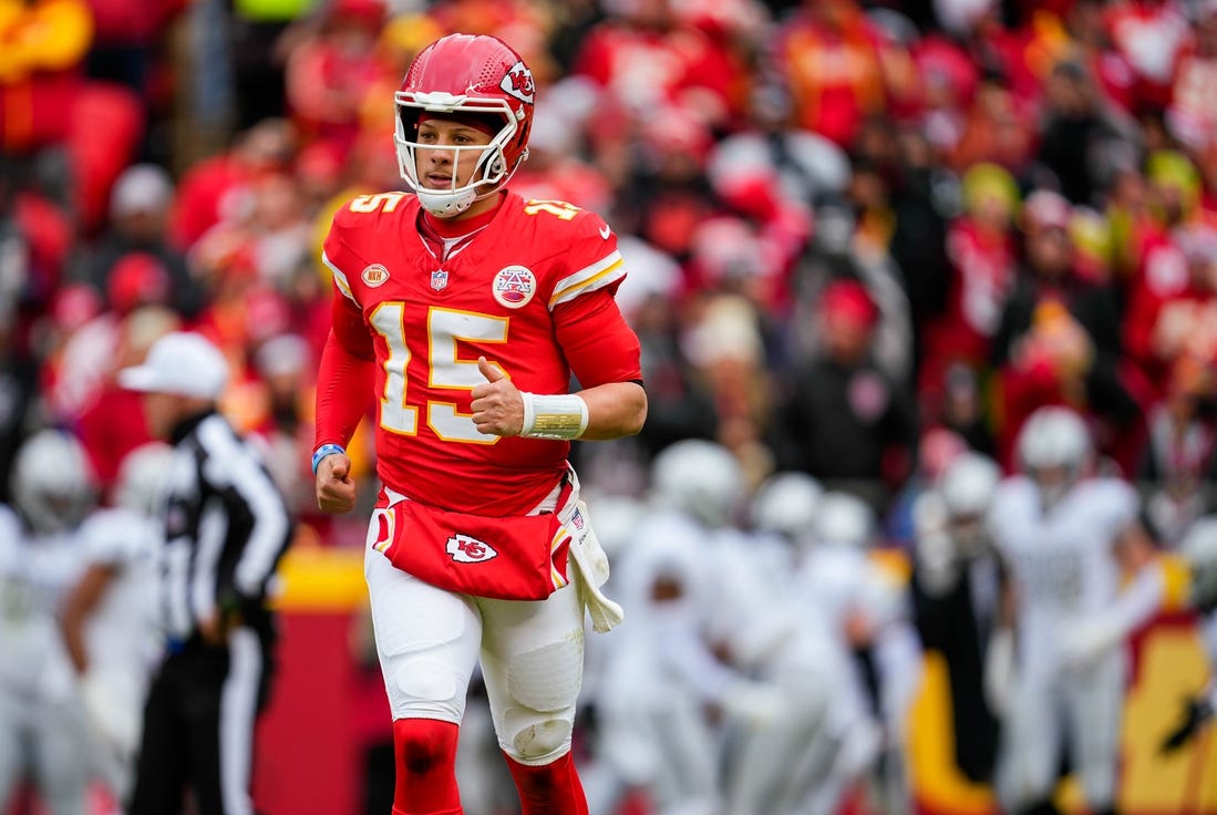 Kansas City Chiefs quarterback Patrick Mahomes (15) runs off the field after throwing an interception for a touchdown during the first half against the Las Vegas Raiders at GEHA Field at Arrowhead Stadium. Mandatory Credit: Jay Biggerstaff-USA TODAY Sports