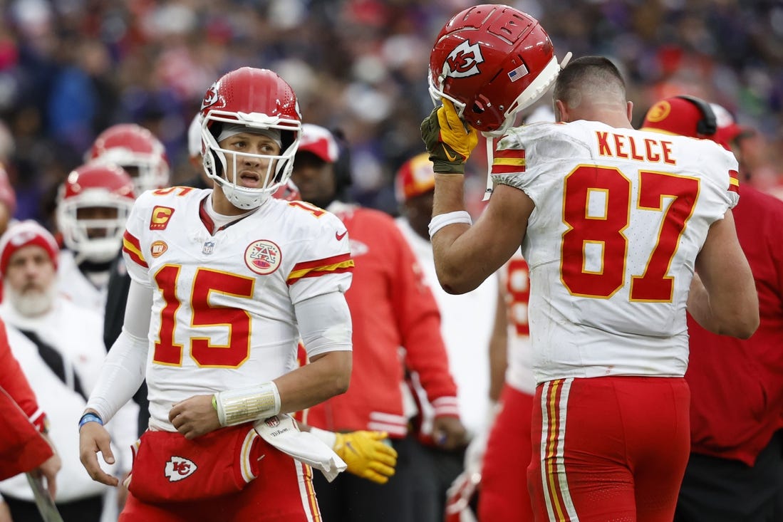 Kansas City Chiefs quarterback Patrick Mahomes (15) celebrates with Chiefs tight end Travis Kelce (87) after a touchdown against the Baltimore Ravens in the AFC Championship football game at M&T Bank Stadium. Mandatory Credit: Geoff Burke-USA TODAY Sports
