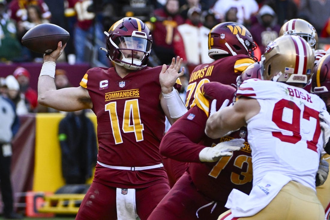 Dec 31, 2023; Landover, Maryland, USA; Washington Commanders quarterback Sam Howell (14) attempts a pass against the San Francisco 49ers during the second half at FedExField. Mandatory Credit: Brad Mills-USA TODAY Sports