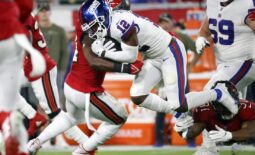 Nov 22, 2021; Tampa, Florida, USA;  New York Giants wide receiver John Ross (12) runs with the ball asTampa Bay Buccaneers inside linebacker Lavonte David (54) tackles during the second quarter at Raymond James Stadium. Mandatory Credit: Kim Klement-USA TODAY Sports