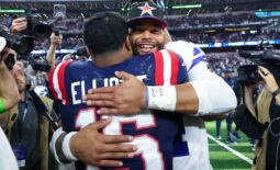 Oct 1, 2023; Arlington, Texas, USA;  Dallas Cowboys quarterback Dak Prescott (4) hugs New England Patriots running back Ezekiel Elliott (15) after the game at AT&T Stadium. Mandatory Credit: Kevin Jairaj-USA TODAY Sports