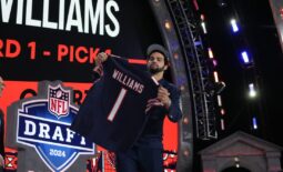 Apr 25, 2024; Detroit, MI, USA; Southern California Trojans quarterback Caleb Williams holds up his jersey after being selected by the Chicago Bears as the No. 1 pick in the first round of the 2024 NFL Draft at Campus Martius Park and Hart Plaza. Mandatory Credit: Kirby Lee-USA TODAY Sports