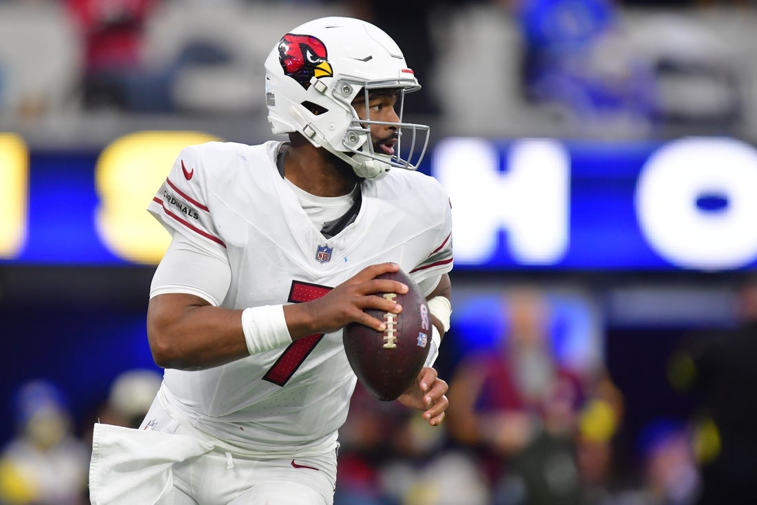 Jan 4, 2026; Inglewood, California, USA;  Arizona Cardinals quarterback Jacoby Brissett (7) rolls out against the Los Angeles Rams during the second half at SoFi Stadium. Mandatory Credit: Gary A. Vasquez-Imagn Images